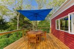 Sit back and relax on the brand new deck that boasts an outdoor dining table and umbrella